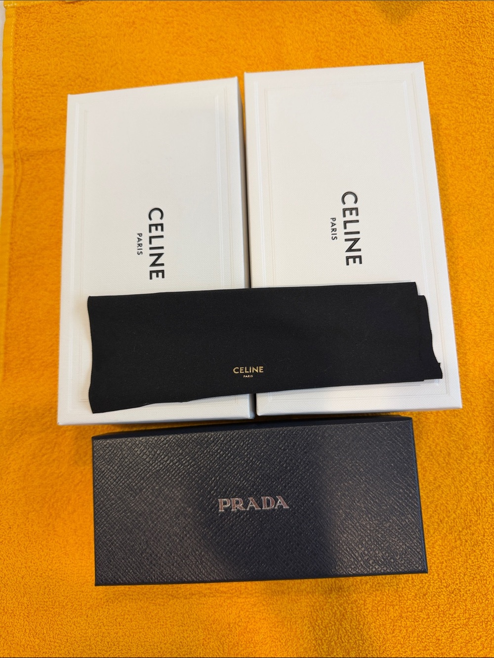 Prada and 2 Celine eye glass boxes.